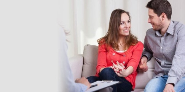 A person sitting on a couch talking to a person AI-generated content may be incorrect.